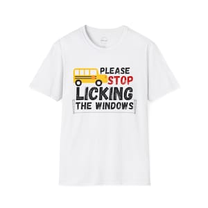 May include: White t-shirt with a yellow school bus graphic and the text "Please Stop Licking The Windows".