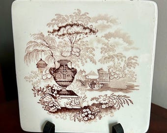Antieke staffordshirebruine transferware keramische theetegel met canova-patroon