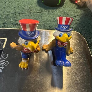 2 vintage Sam the Eagle figures