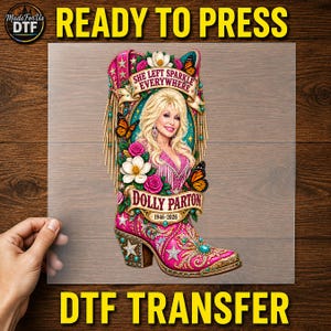 May include: A DTF transfer sheet featuring a pink cowboy boot graphic with a portrait of Dolly Parton, surrounded by flowers, butterflies, and stars. The text reads She Left Sparkle Everywhere, Dolly Parton, and 1946-2026 in a decorative banner.