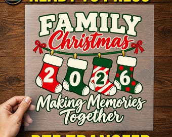 May include: A DTF transfer sheet featuring the text "READY TO PRESS" at the top and "DTF TRANSFER" at the bottom. The central graphic displays "FAMILY Christmas" above four hanging stockings labelled "2", "0", "2", "6", and "Making Memories Together".