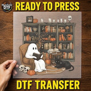May include: A DTF transfer sheet featuring a cartoon ghost reading a book in a brown armchair, a black cat, pumpkins, skulls, and a bookshelf filled with books and candles. The text READY TO PRESS DTF TRANSFER is visible at the top and bottom.