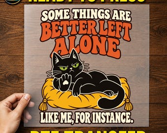 May include: A DTF transfer sheet featuring a black cat lying on a yellow pillow with the text "SOME THINGS ARE BETTER LEFT ALONE LIKE ME, FOR INSTANCE." The cat has green eyes and is holding up one paw in a gesture of dismissal.