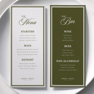 May include: Two rectangular menu cards with white and olive green backgrounds and dark green borders. The left card is titled The Menu with sections for Starters, Main, and Dessert. The right card is titled The Bar with Wine, Beer, and Non-Alcoholic sections. Both cards feature the text Anna + Paul.
