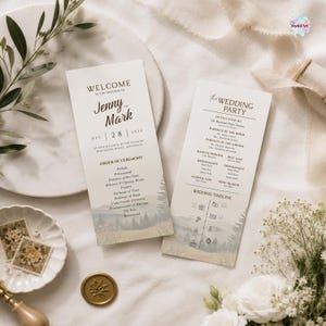 Peut inclure: Deux cartes de programme de mariage verticales avec des fonds crème et une illustration de paysage atténuée en bas. Le texte inclut Welcome to the Wedding of Jenny and Mark, Dec 28 2025, Order of Ceremony, The Wedding Party et Wedding Timeline.