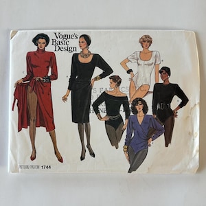 May include: Vogue's Basic Design sewing pattern featuring illustrations of various women's fashion designs. The designs include a red dress, a black dress, a white bodysuit, a black off-the-shoulder bodysuit, and a blue wrap bodysuit. The pattern number is 1744.