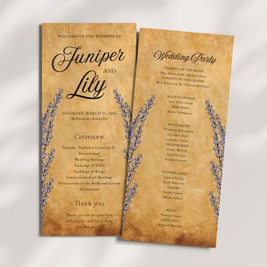 May include: Two-page wedding program with a vintage paper texture. The text reads "Welcome to the Wedding of Juniper and Lily" with the date and location. Lavender sprigs frame the text. The second page lists the wedding party.