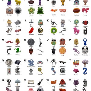 May include: A collection of 104 miniature alphabet trinkets arranged in a grid, labeled A through Z. Each letter features four small charms representing objects like an apple, bear, crown, dinosaur, and various animals, foods, and symbols.