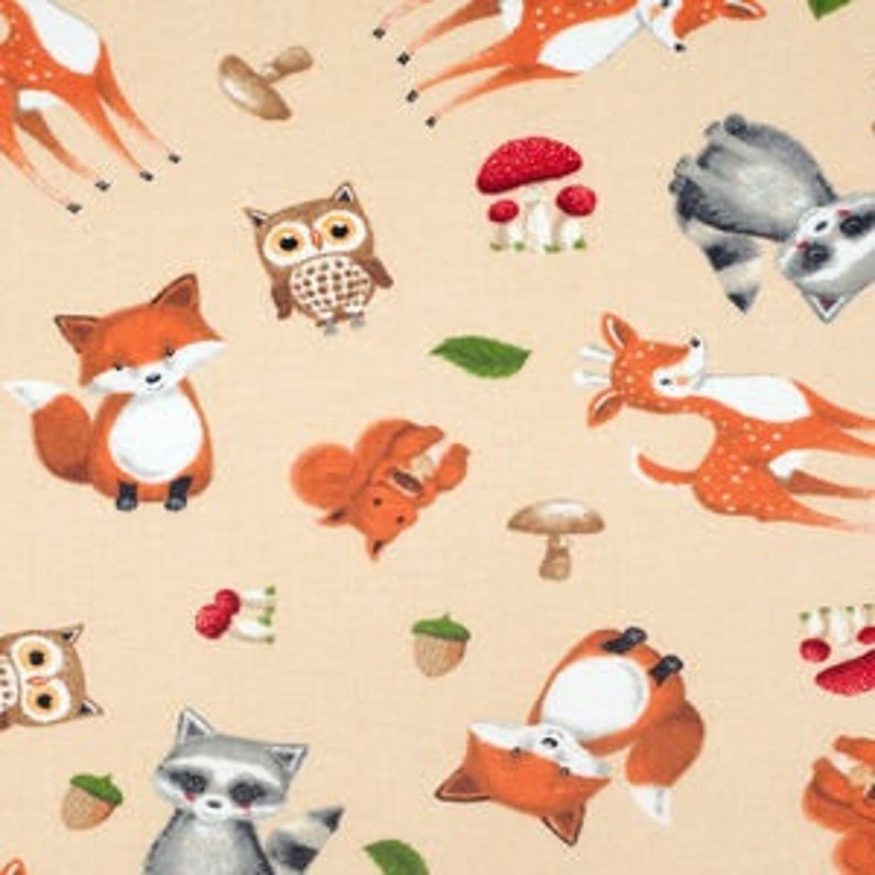 May include: A light beige fabric featuring a repeating pattern of woodland animals including orange foxes, brown owls, and grey raccoons, interspersed with red mushrooms, brown acorns, green leaves, and small brown mushrooms on a textured background.
