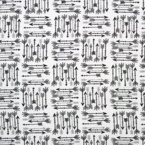 May include: A white fabric featuring a repeating pattern of black and gray arrows arranged in alternating horizontal and vertical blocks. Each block contains a cluster of arrows pointing in various directions, creating a geometric grid design.
