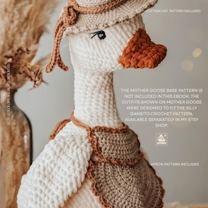 May include: A crocheted Mother Goose doll wearing a beige hat with a brown ribbon, a brown bib, and a matching scarf. The goose has a white body, an orange beak, and black eyes. The image includes text that says "Cottage Hat Pattern Included" and "Apron Pattern Included."