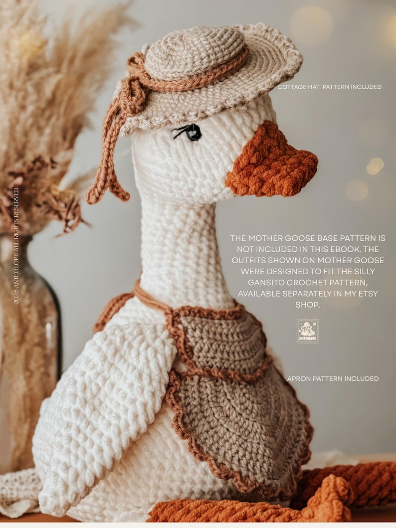 May include: A crocheted Mother Goose doll wearing a beige hat with a brown ribbon, a brown bib, and a matching scarf. The goose has a white body, an orange beak, and black eyes. The image includes text that says "Cottage Hat Pattern Included" and "Apron Pattern Included."