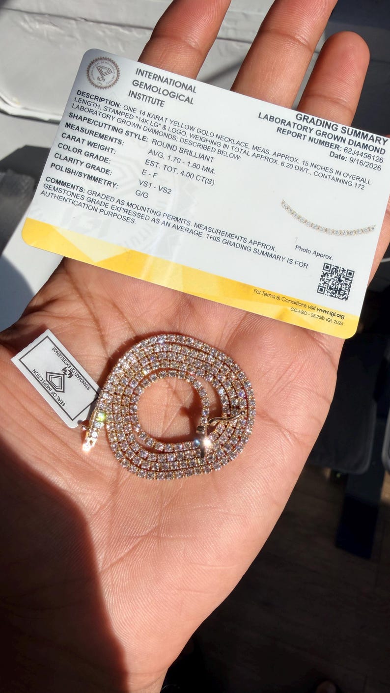 May include: A 14 karat yellow gold necklace with round brilliant laboratory grown diamonds, accompanied by an International Gemological Institute grading summary report stating a 15 inch length and a total weight of 4.00 carats.