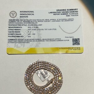 May include: A 14k yellow gold necklace with 168 laboratory grown diamonds, accompanied by an International Gemological Institute grading summary card. The necklace is 15 inches in length, with round brilliant diamonds averaging 2.10 mm.