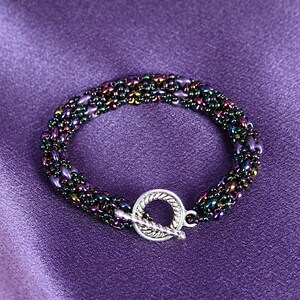 Individually hand crafted super duo bracelet in rich dark jewel tones of purples and blues