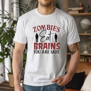 Zombies Eat Brains You're Safe TShirt - Funny Halloween Zombie Humor Tee, Sarcastic Spooky Graphic Shirt, Unisex Zombie Joke Tee Shirt