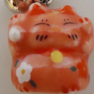 The Japanese Little Lucky Cat Charm.
