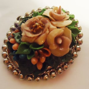 The Antique Spanish Flower Resin Brooch .From the 40s