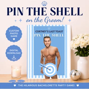 May include: A party game sign with the text "PIN THE SHELL on the Groom!" features a shirtless man with a target. The sign is on a table with flowers, a candle, and a disco ball. The game is for a bachelorette party.