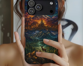 May include: A smartphone case featuring a stained glass effect design of a mountain landscape at sunset with a castle on a peak and a deer in the foreground. The artwork displays a vibrant color palette of orange, blue, and green tones.
