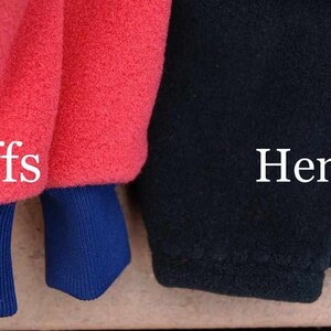 May include: Close-up of a red fleece jacket with blue cuffs and a black fleece jacket with a hem. The text "Cuffs" is written on the red jacket and the text "Hem" is written on the black jacket.