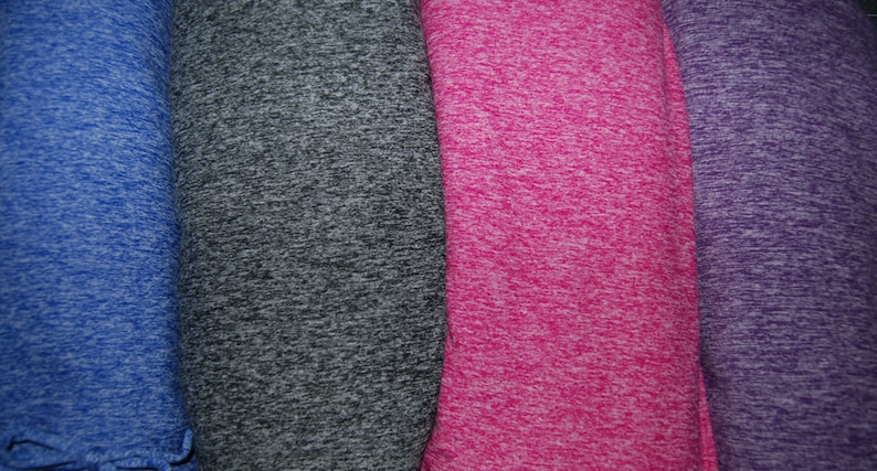 May include: Four fabric swatches in different colors: blue, gray, pink, and purple. The fabric has a textured, speckled pattern.