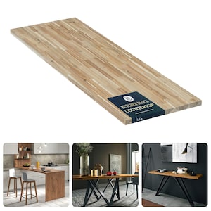 K&ouml;nnte beinhalten: Eine rechteckige Arbeitsplatte aus hellem Holz im Metzgerblock-Stil mit sichtbarer Maserung. Ein dunkelblaues Etikett an der Ecke tr&auml;gt den Text "BUTCHER BLOCK COUNTERTOP" und "3,8 cm". Die Oberfl&auml;che ist glatt mit variierenden Holzt&ouml;nen.