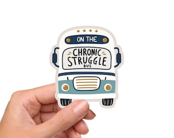 May include: A sticker in the shape of a school bus with the words "ON THE CHRONIC STRUGGLE BUS" in a playful font. The bus is white, teal, and navy blue with gold accents. The sticker is held by a hand.