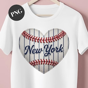 May include: White t-shirt featuring a heart-shaped baseball design. The heart is made to look like a baseball with red stitching and blue pinstripes. The words "New York" are written in a navy blue script font.