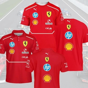 May include: Red Ferrari team shirts with sponsor logos, including HP, Shell, and UniCredit. The shirts have white accents and the Ferrari emblem. One is a crew neck, and two are polo shirts.