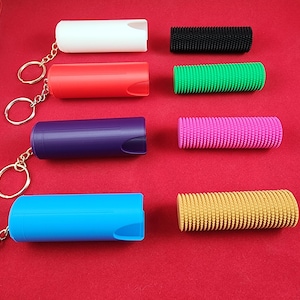 Micro Spike Stim Fidget with magnetic keychain case.