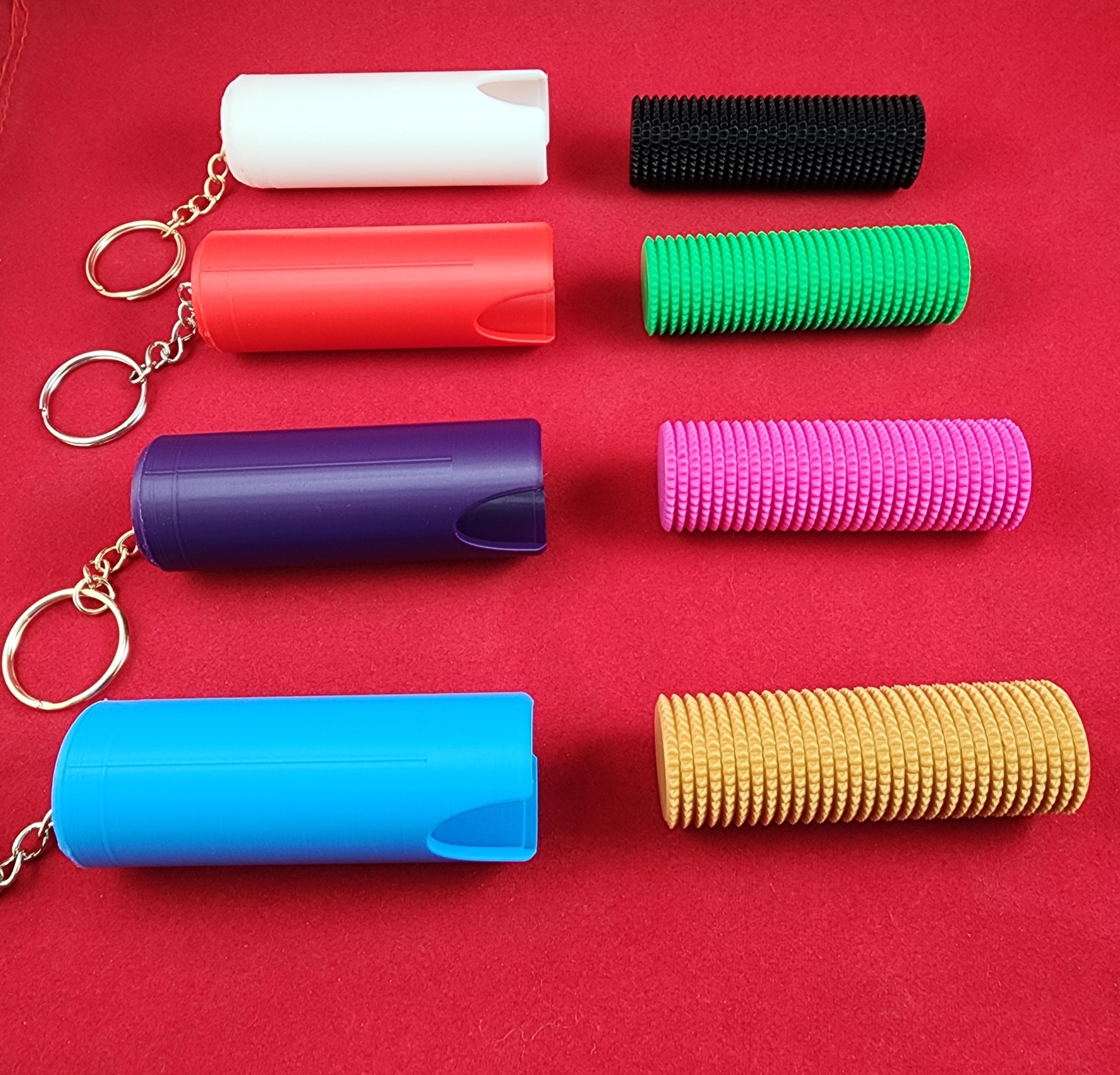 Micro Spike Stim Fidget with magnetic keychain case.