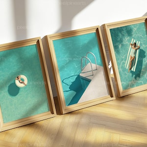 May include: Three framed art prints featuring a pool scene. One print shows a person on a white inner tube, another shows a pool with a ladder, and the third shows a person on a striped pool float. The water is a bright turquoise color.