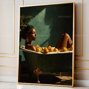 May include: A framed art print depicts a person relaxing in a vintage bathtub filled with lemons. The artwork features a woman with dark skin, wearing gold earrings, and a gold necklace. The background is a teal green color, and the frame is gold.