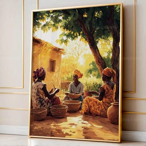 May include: A framed art print depicts three women seated outdoors, crafting with baskets. The scene is bathed in warm sunlight, with a building and tree in the background. The women wear headscarves and patterned clothing, with earthen tones dominating the color palette.