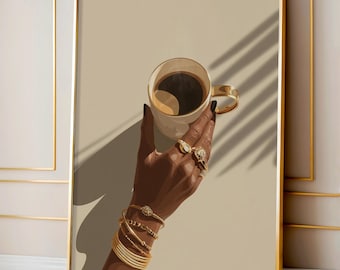 May include: A framed art print featuring a hand adorned with gold bracelets and rings, holding a coffee cup. The cup has a gold handle and is filled with dark coffee. The background is a neutral beige with shadows.
