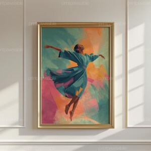 May include: Framed art print featuring a person in a flowing teal dress, arms outstretched in a dance pose. The background has abstract brushstrokes of teal, orange, and pink. The artwork is in a gold frame.
