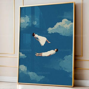 May include: A framed art print featuring two figures floating in a blue sky with fluffy white clouds. The figures are dressed in white and appear to be drifting. The artwork has a dreamy, surreal quality.