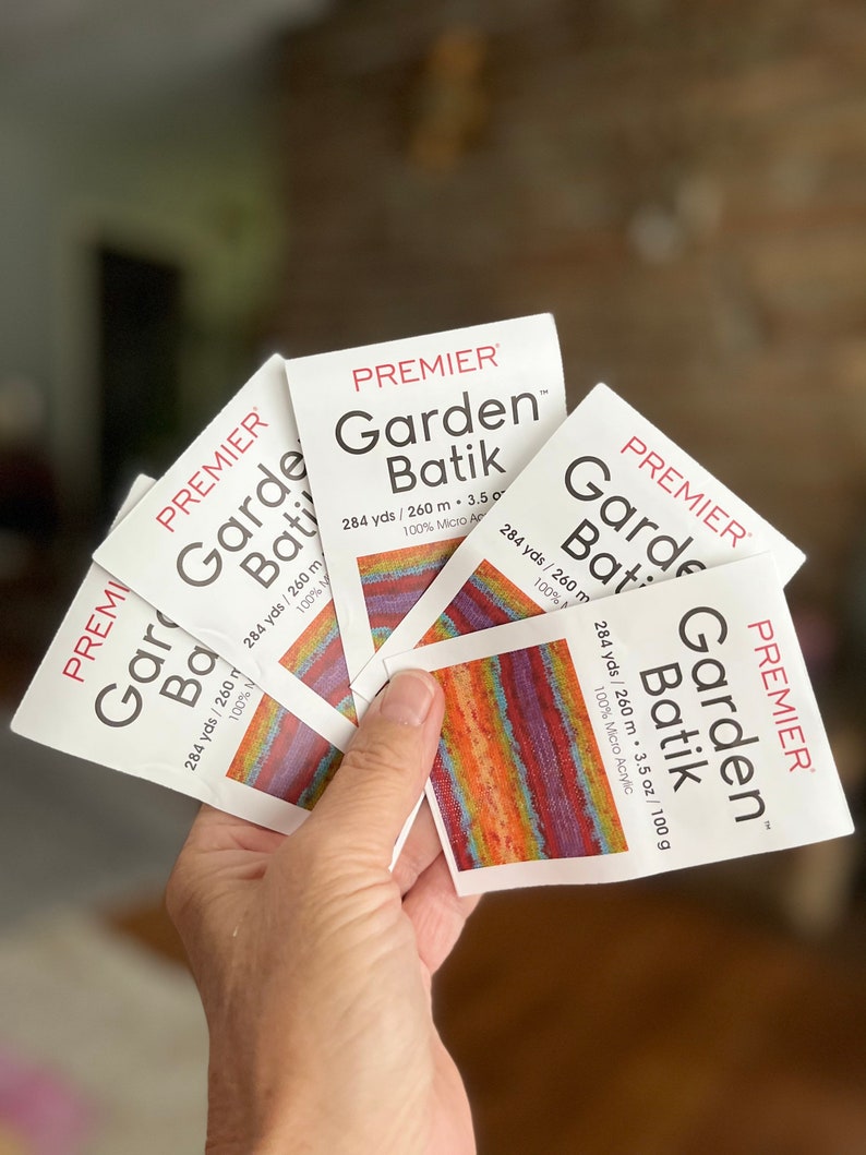 May include: Five skeins of Premier Garden Batik yarn in a rainbow of colors. Each skein is 284 yards / 260 meters and 3.5 ounces / 100 grams. The yarn is 100% micro acrylic.