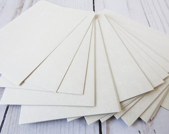 May include: A stack of 12 off-white cardstock sheets, each measuring 8.5 inches by 11 inches.