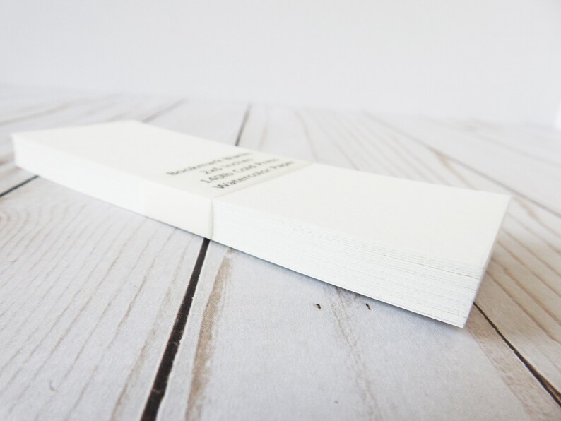 May include: A stack of white blank note cards with the text "Remarkable Notes, 100 Count, Lightly Colored, Watercolor Paper" printed on the top card.