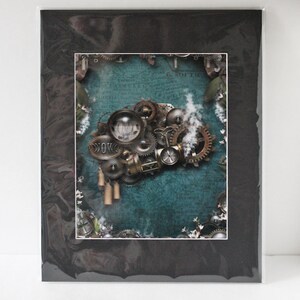 May include: A steampunk-inspired print featuring a collection of gears, cogs, and other mechanical elements on a teal background. The print is framed with a black mat.