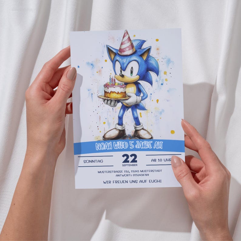 May include: A blue and white birthday invitation with a cartoon character holding a cake. The invitation says "Noah wird 5 Jahre alt" and includes the date, time, and address.
