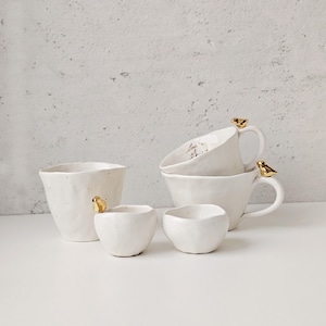 Organic shaped Artfully crafted handmade pottery plates and mugs rustic ceramic dishes