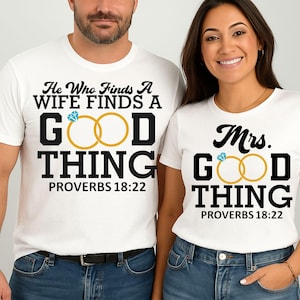 May include: Matching white t-shirts with black text and gold ring graphics. One shirt reads "He Who Finds A Wife Finds A Good Thing" and the other says "Mrs. Good Thing". Both shirts have "Proverbs 18:22" printed below.