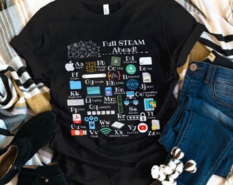 May include: Black t-shirt with the text "Full Steam Ahead!" and various computer-related icons. The shirt is paired with blue jeans, black ankle boots, and a striped scarf. A sprig of cotton adds a decorative touch.
