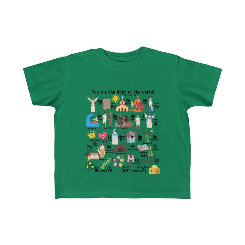 May include: A green t-shirt with a colorful alphabet design featuring illustrations of religious figures and objects. The text "You are the light of the world!" is printed at the top of the shirt.