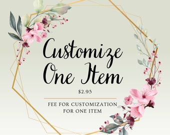 May include: A gold geometric frame with pink and green floral accents. The text "Customize One Item $2.95 FEE FOR CUSTOMIZATION FOR ONE ITEM" is inside the frame.