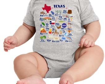 May include: A gray baby onesie with a graphic of the state of Texas and an alphabet with illustrations of Texas-themed items. The text "TEXAS" is at the top of the graphic.