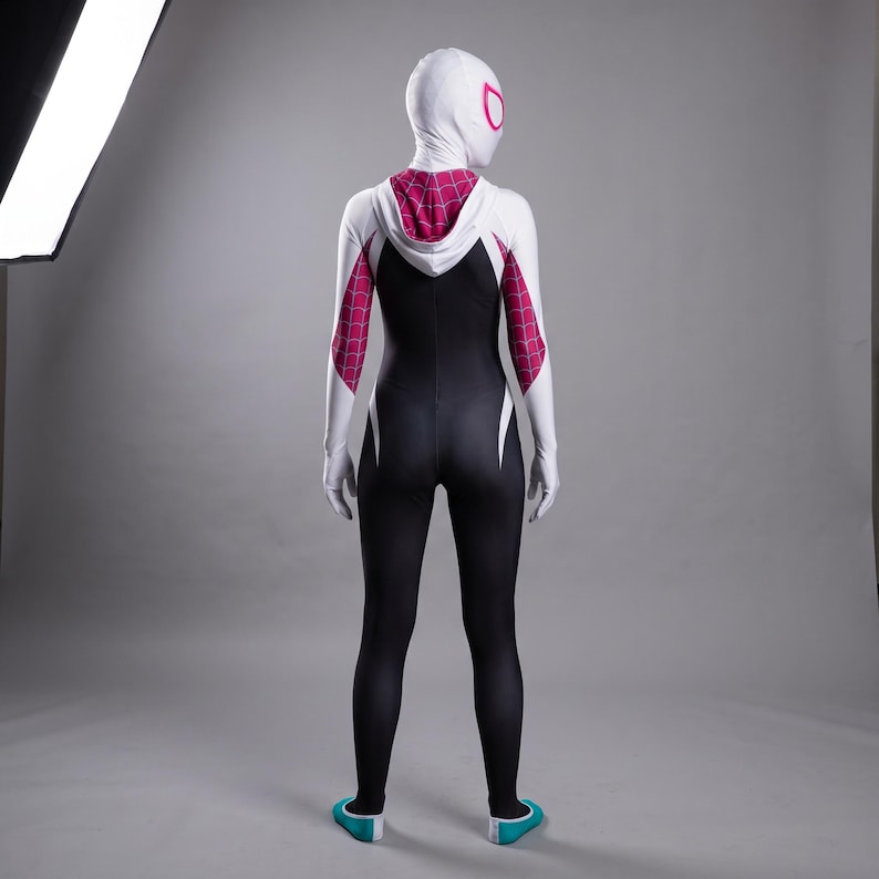 May include: A full-body spandex bodysuit featuring a white hood, long sleeves, and a black torso. The design includes a pink and white web pattern on the hood and upper arms, with white accents on the sides and teal-colored footwear at the base.